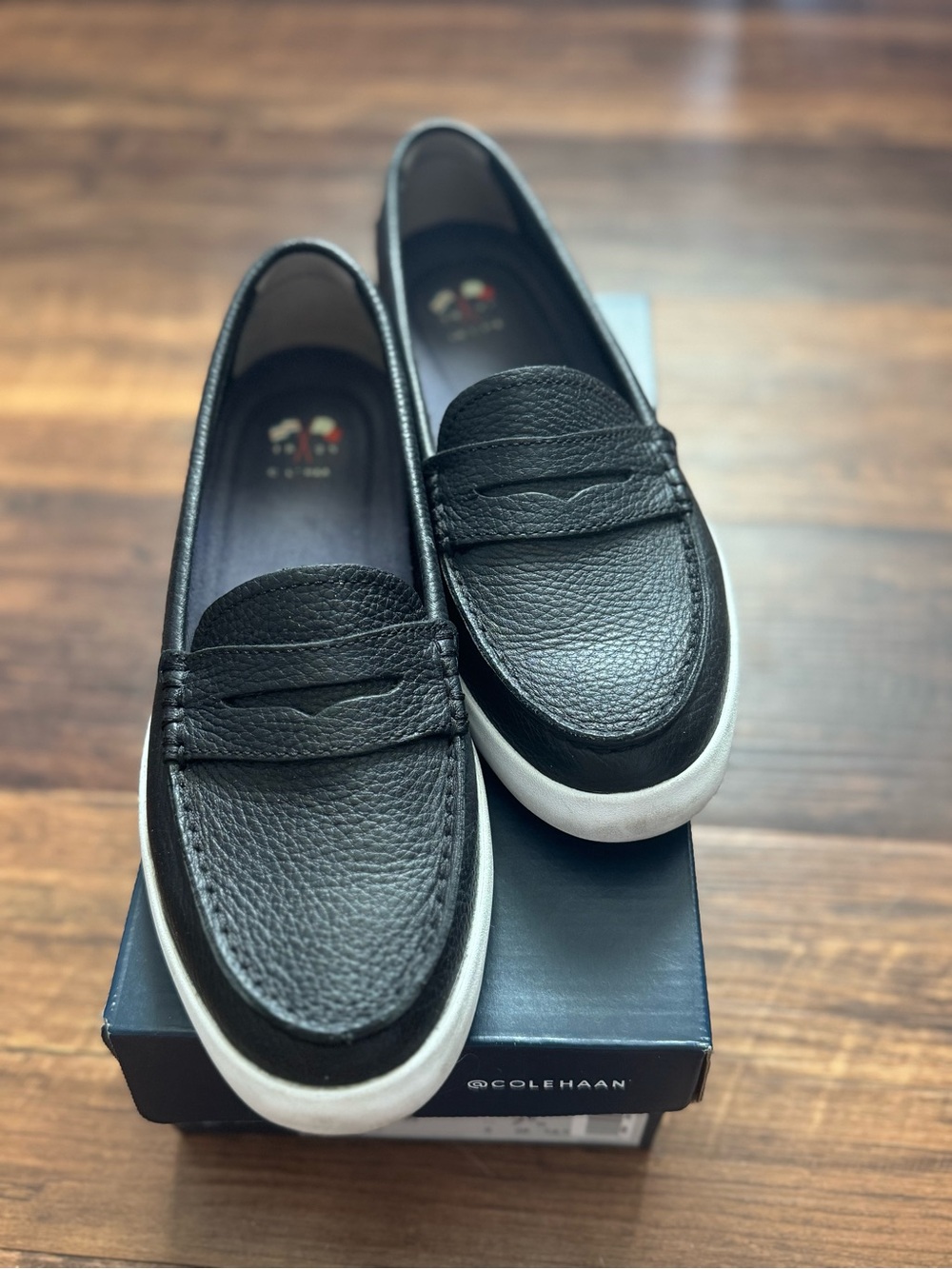 Cole Haan Black Pebbled Leather Slip-On Loafers with White Sole
